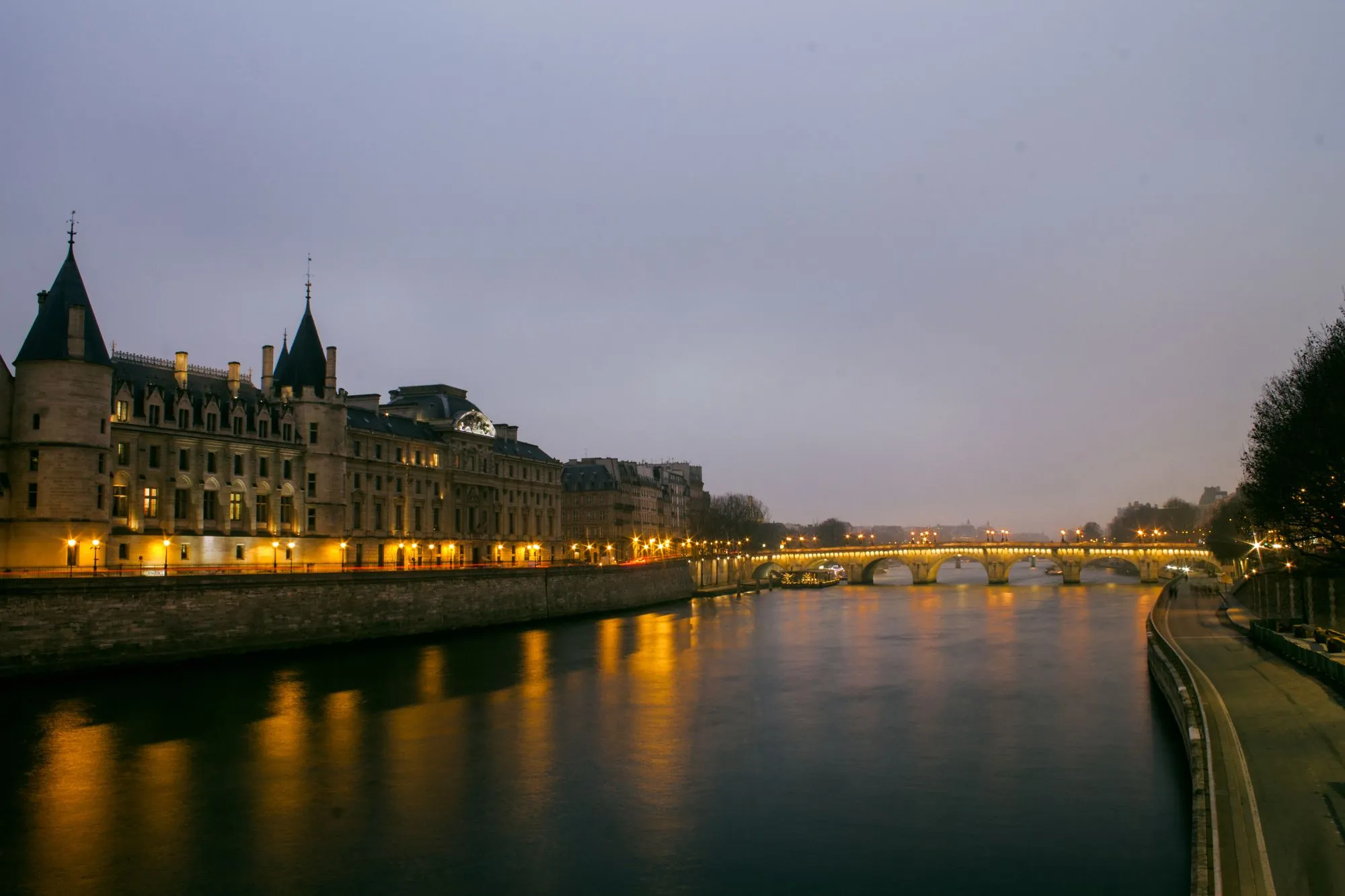 The Conciergerie and the Seine at dusk